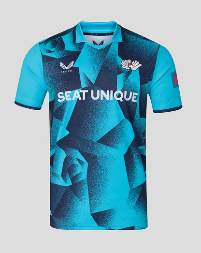 Blue sports jersey with geometric pattern and visible branding on a gray background