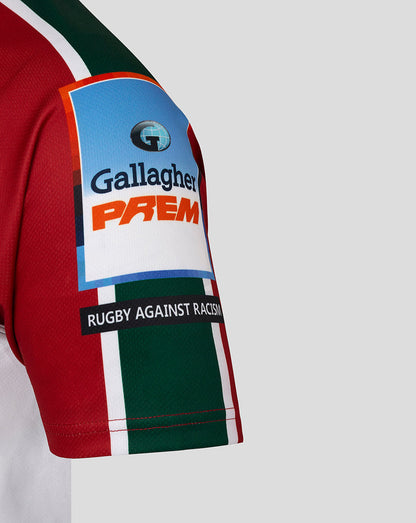 Sleeve close up showing Gallagher Premiership patch and Rugby Against Racism banner on red green white striped fabric