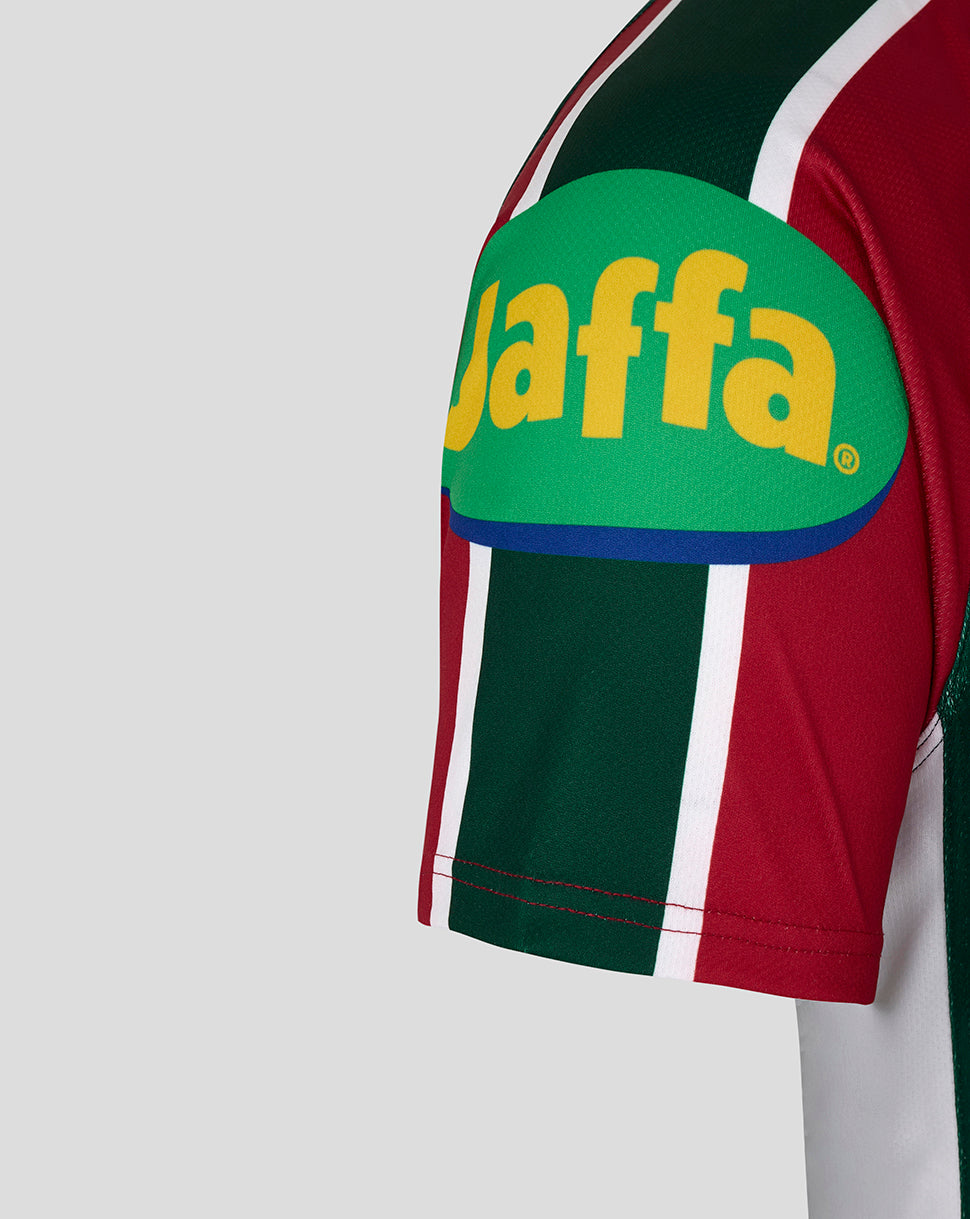 Sleeve view of the Leicester Tigers Junior 25/26 home shirt featuring a large green patch with yellow waffa lettering