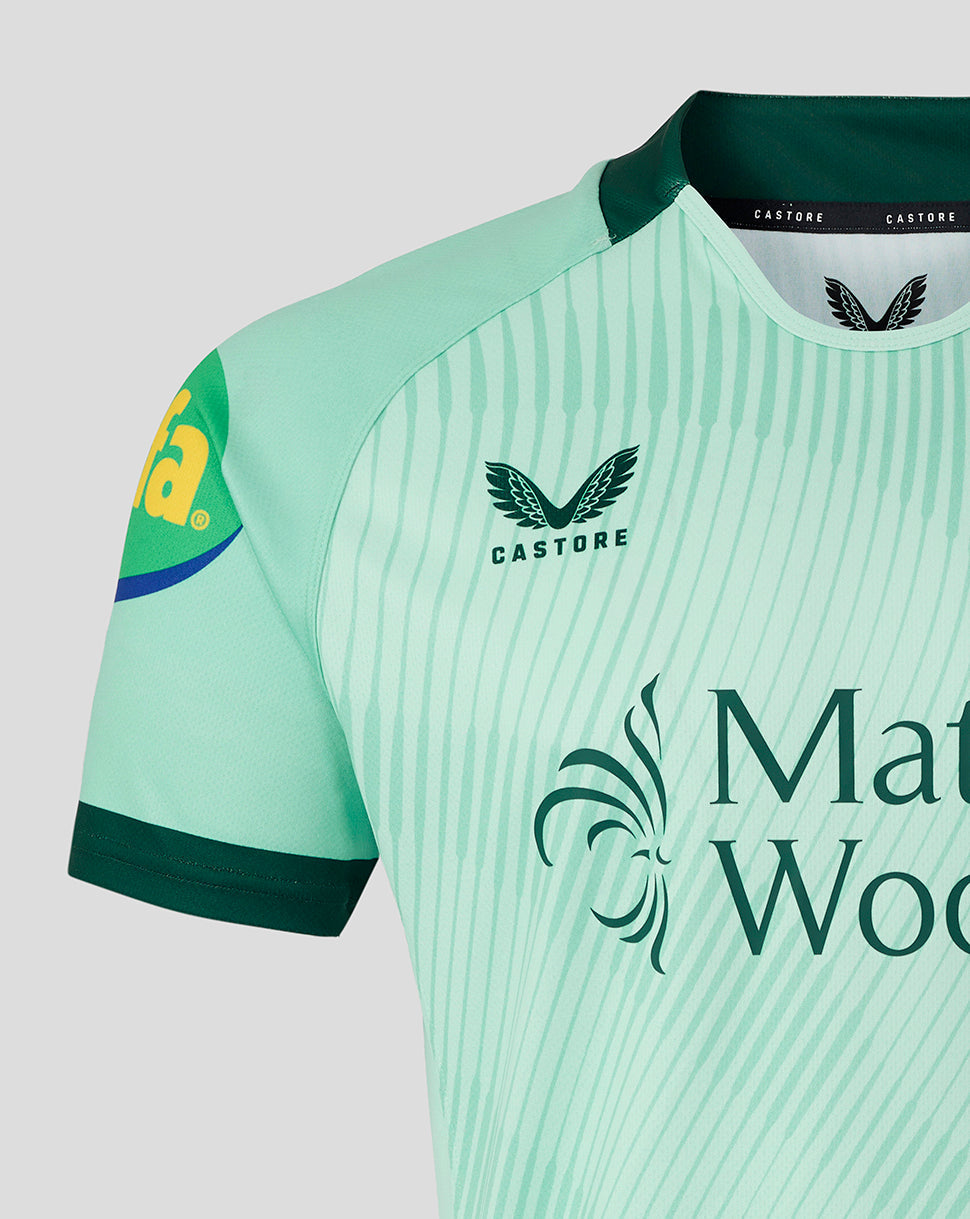 Close-up of mint green Leicester Tigers away shirt chest area showing Castore logo and tiger crest.