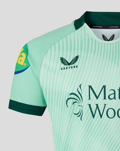 Close up of mint green Leicester Tigers junior away shirt with diagonal stripes and Castore branding.