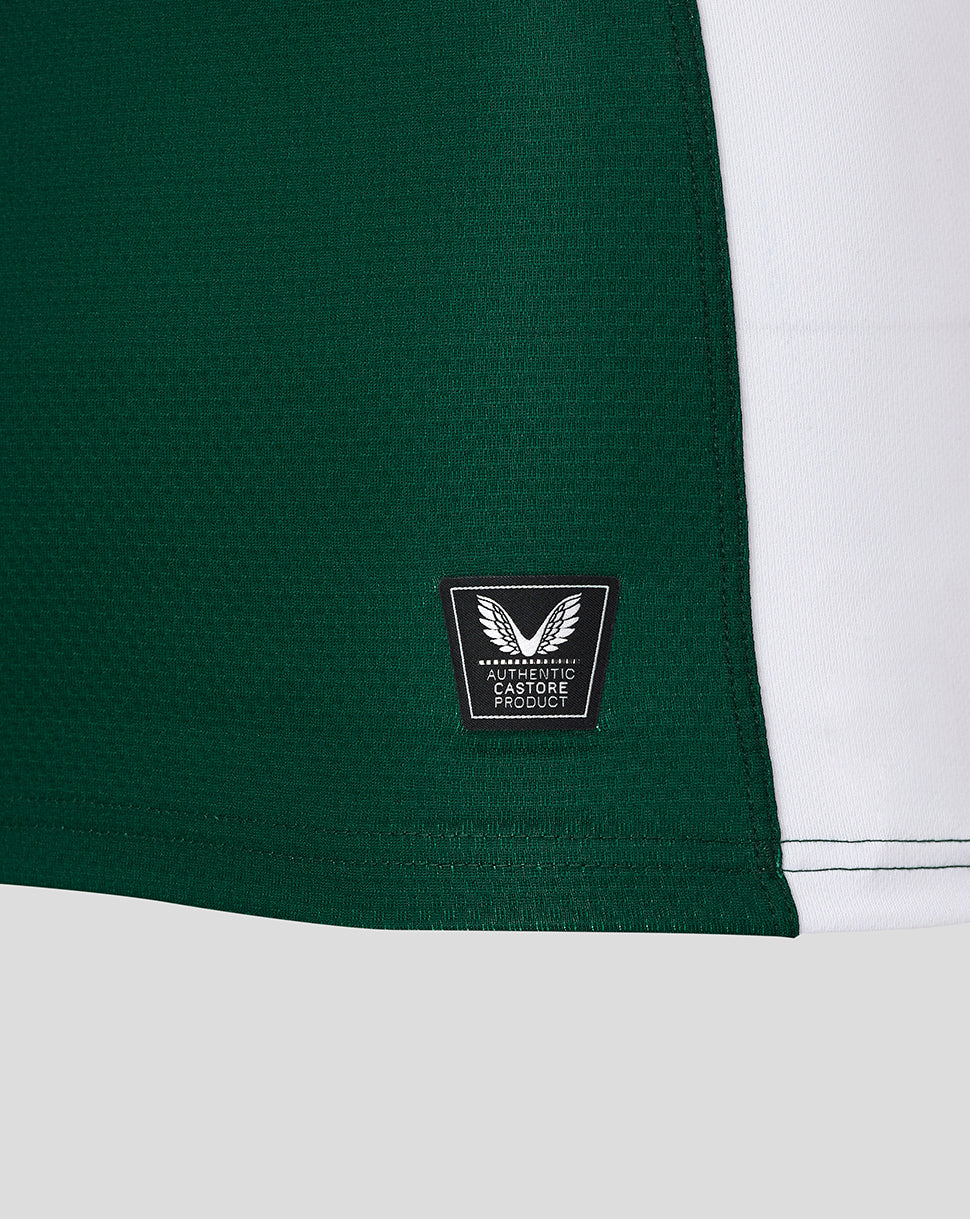 Lower side panel of green Leicester Tigers junior jersey with authentic Castore product badge