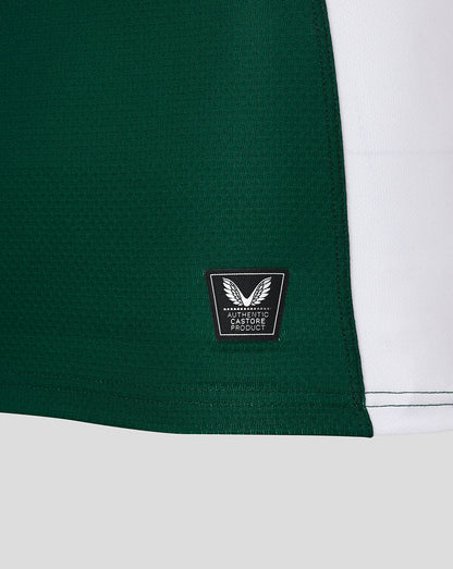 Lower side panel of green Leicester Tigers junior jersey with authentic Castore product badge