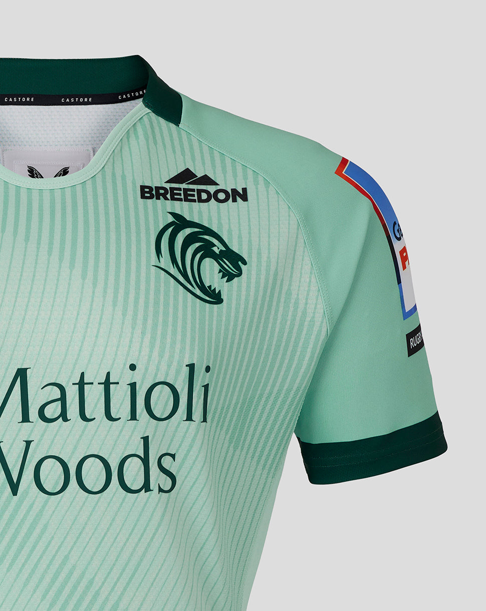 Mint green Leicester Tigers Junior 25/26 Pro Away Shirt chest showing Mattioli Woods sponsor and Breedon logo with tiger head
