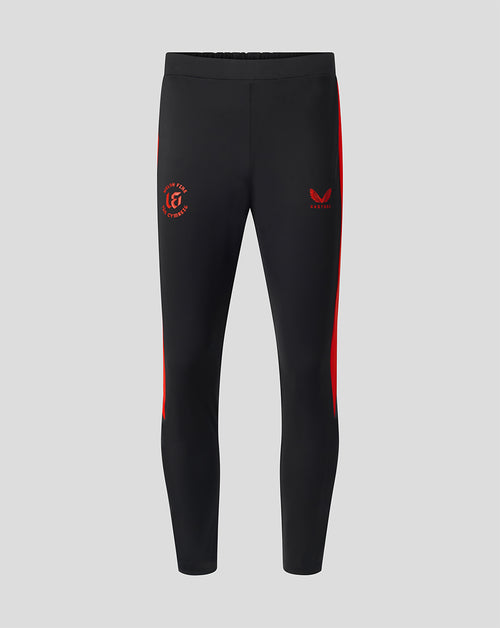 Front view of black Welsh Fire 100 Sub Slim Fit pant with red side panels and branding