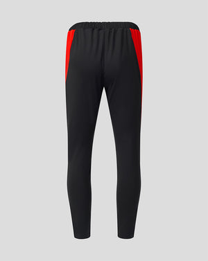 Rear view of black Welsh Fire 100 Sub Slim Fit pant with red side panels