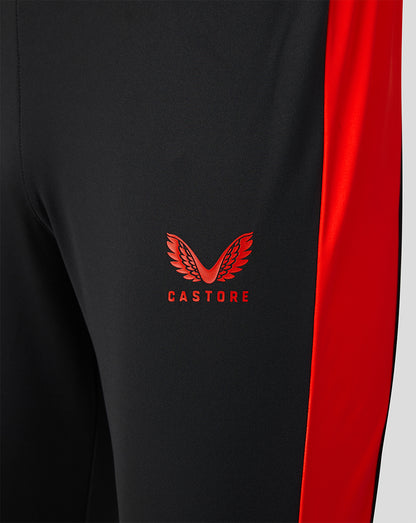 Close up of black Welsh Fire sub slim fit pant with red side panel and Castore logo