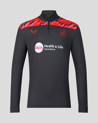 Front view of the Welsh Fire 2026 mens performance quarter zip top in dark color with red geometric shoulder panels, Vitality sponsor logo, and Welsh Fire crest.