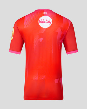 Back view of Welsh Fire jersey in red with Vitality logo and pink geometric pattern.