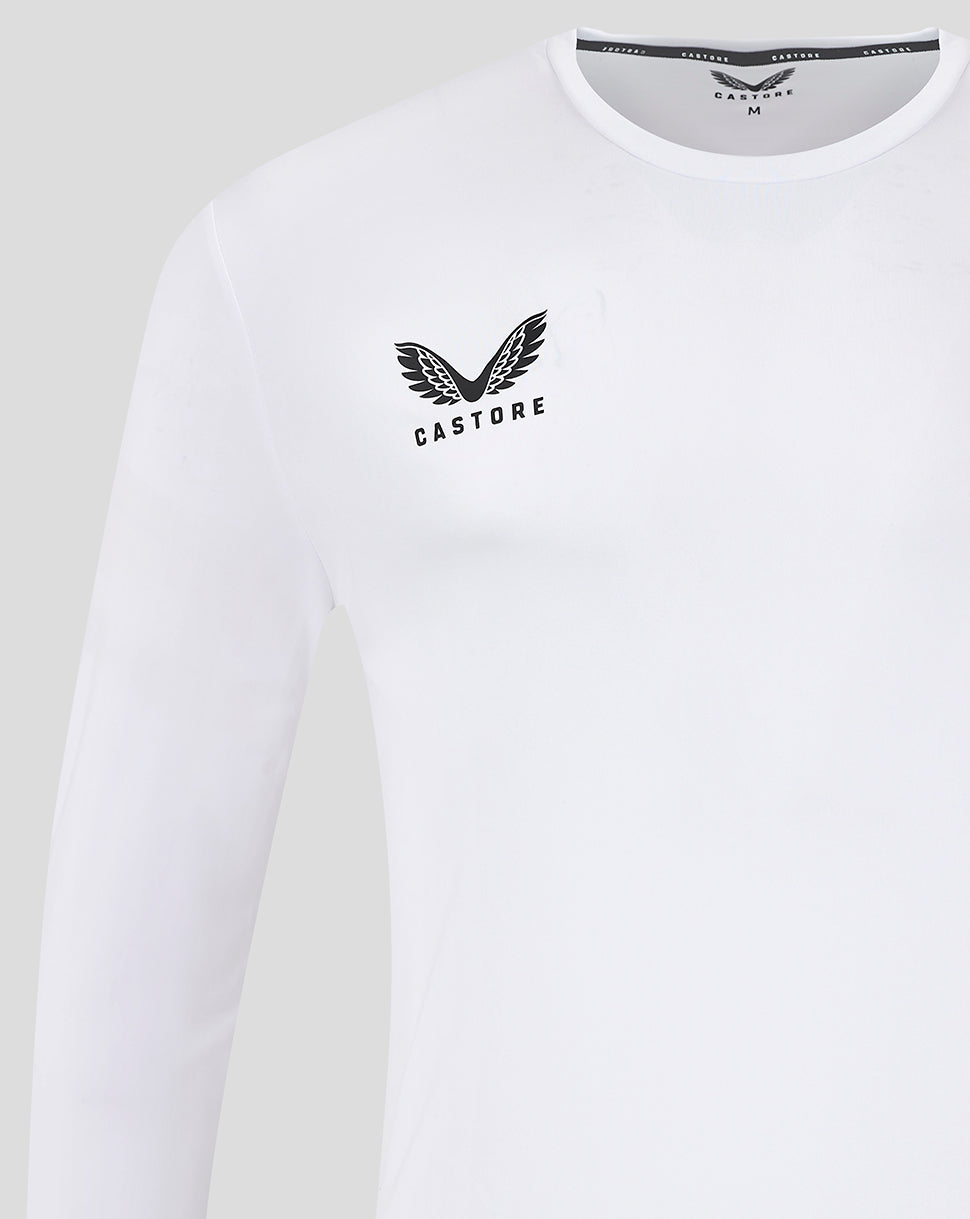 Close up of white long sleeve training shirt showing Castore logo on left chest near neckline