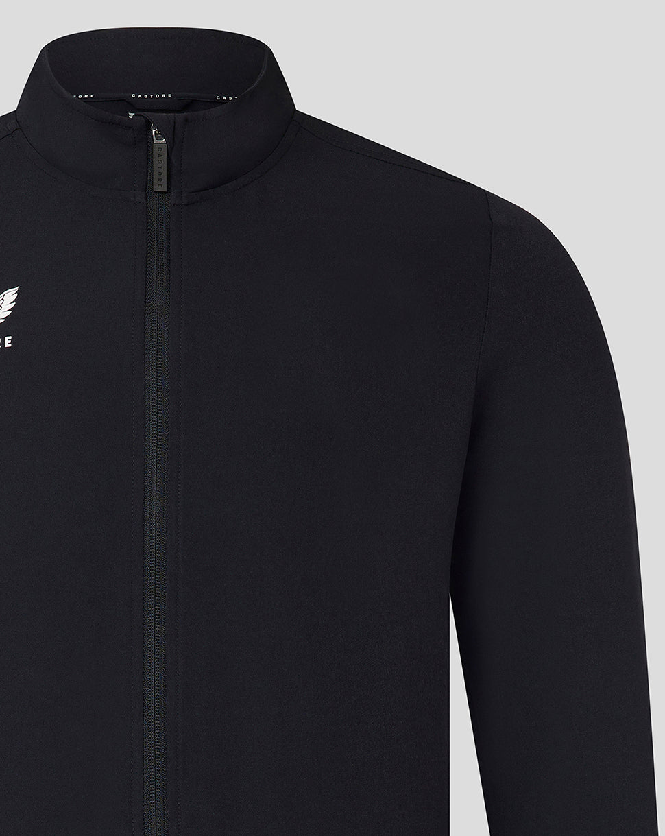 Front view of black Castore track jacket with full-length zipper and white wing logo on the left chest