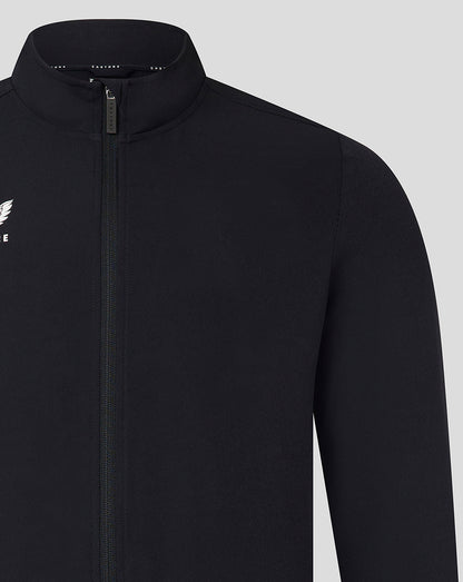 Front view of black Castore track jacket with full-length zipper and white wing logo on the left chest