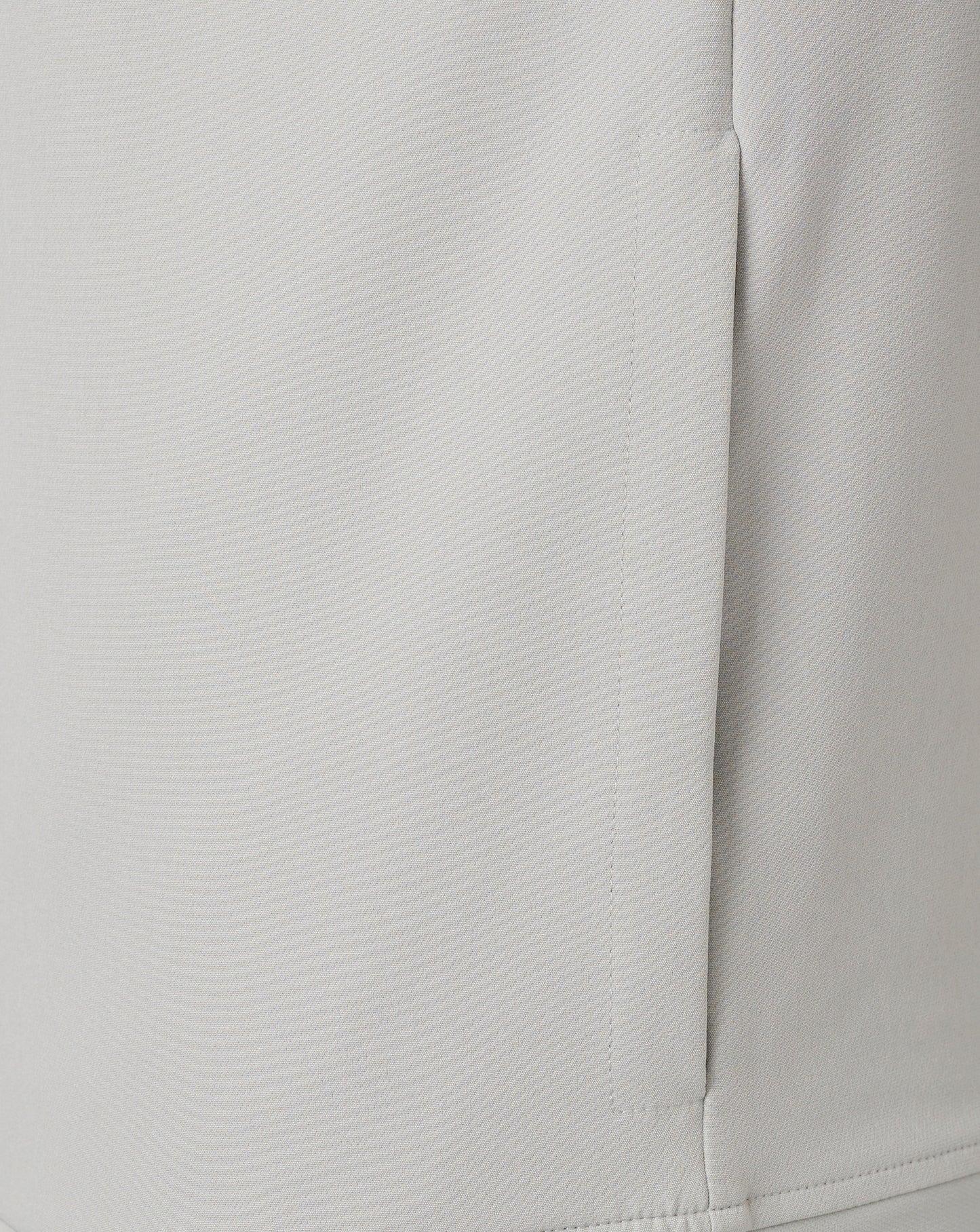 Center front zipper and neck seam on a light grey track jacket.