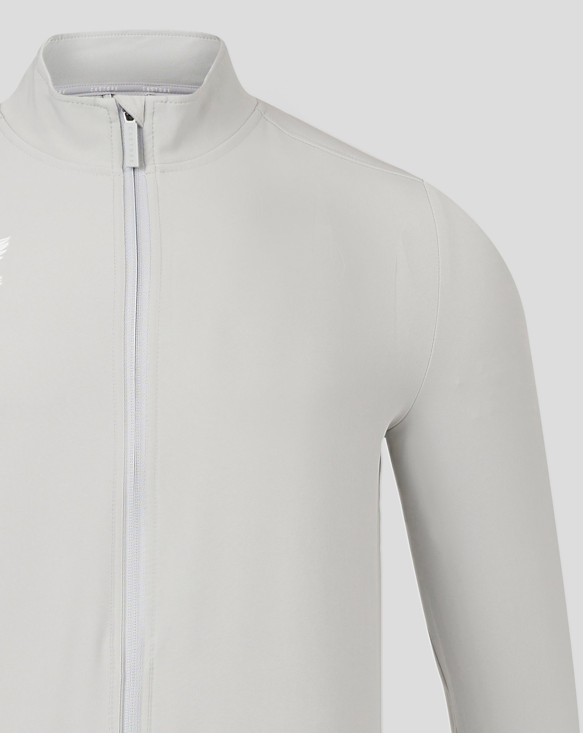 Close-up of collar and front zip on light gray Mens Track Jacket High Rise with Castore branding.