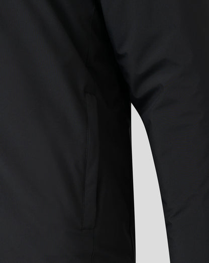 Close-up of black bench jacket fabric showing a front seam and folded edge