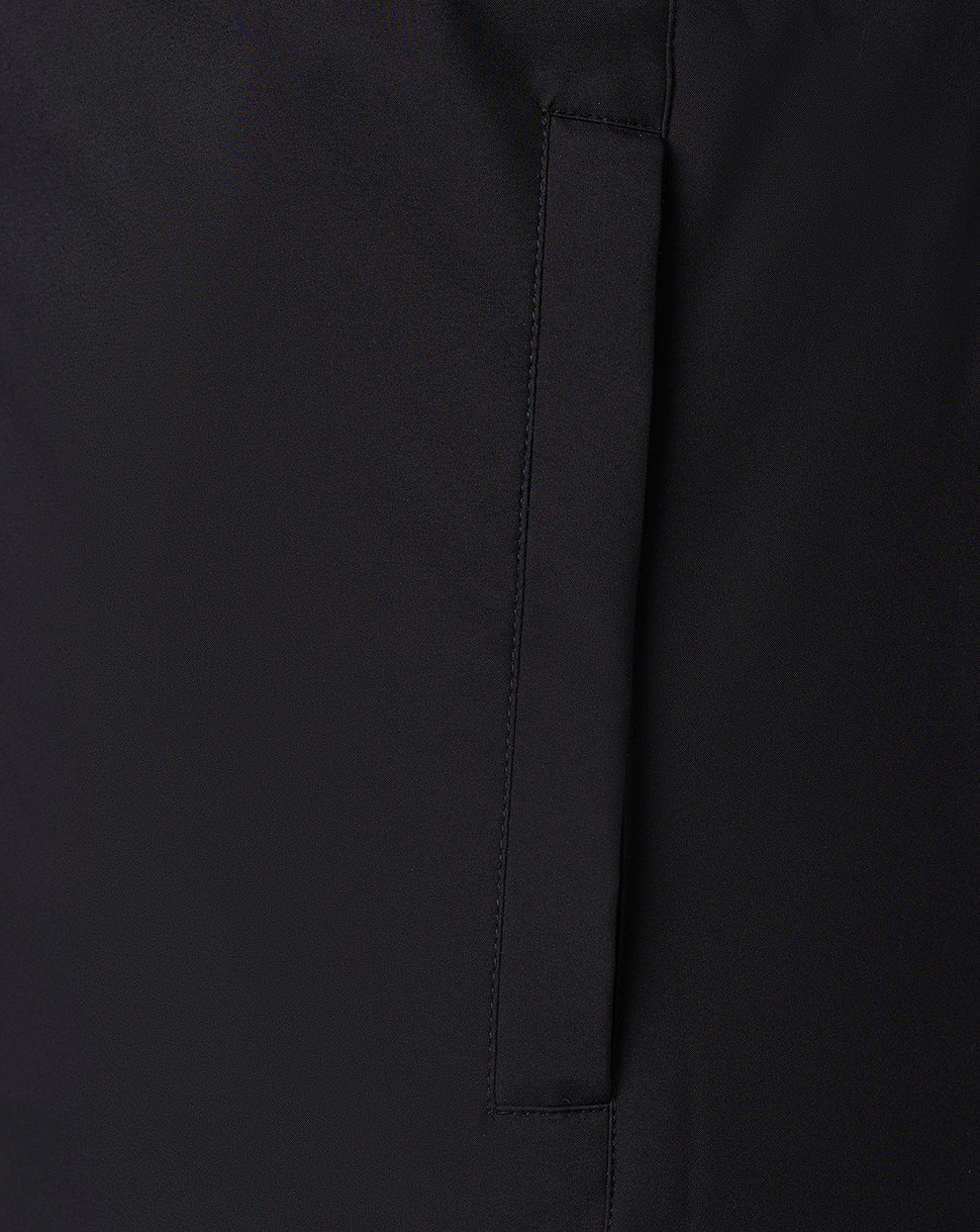 Vertical pocket slit on black bench jacket with neat stitching