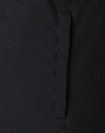 Vertical pocket slit on black bench jacket with neat stitching