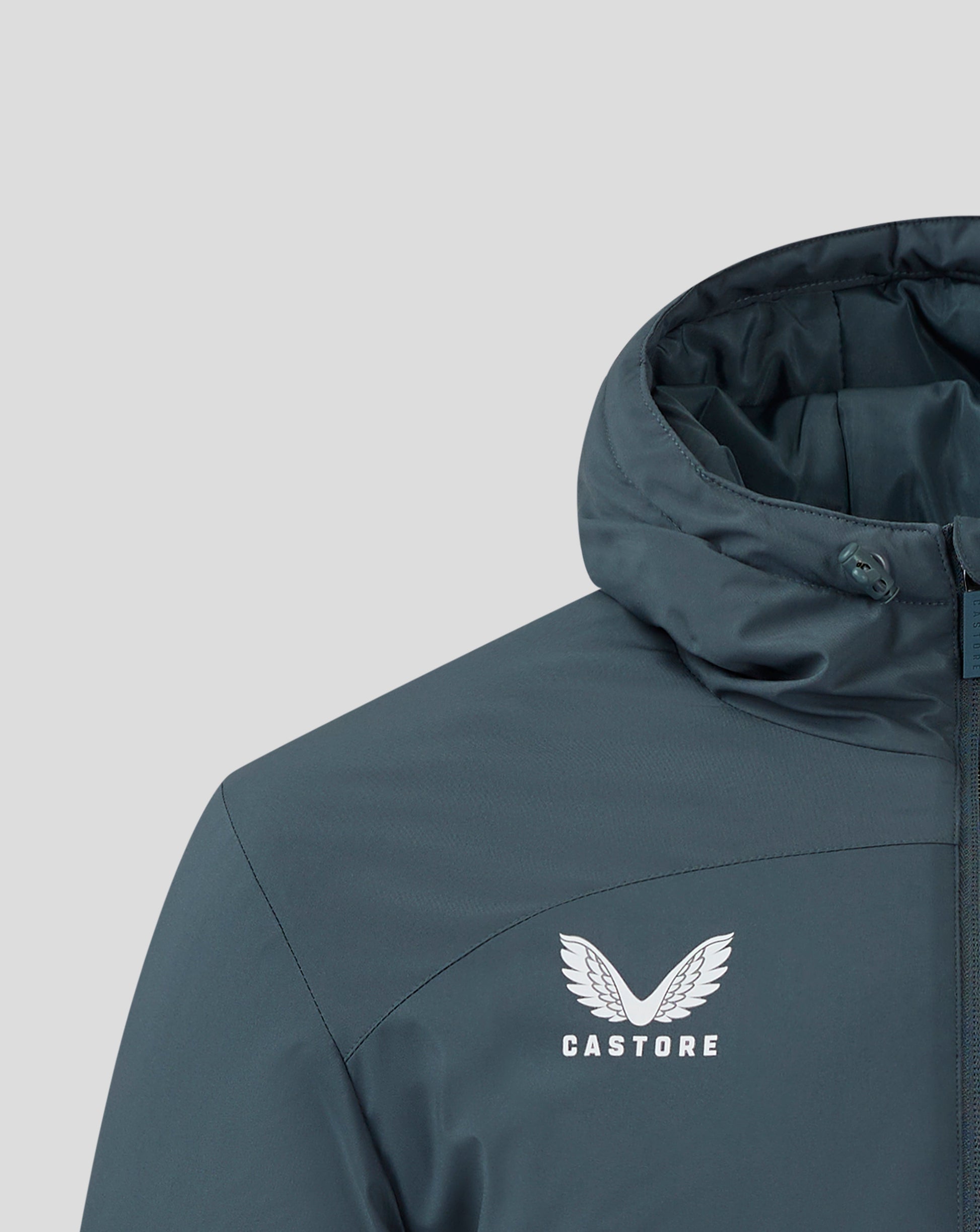 Hooded dark slate bench jacket close up with drawcords and Castore branding.