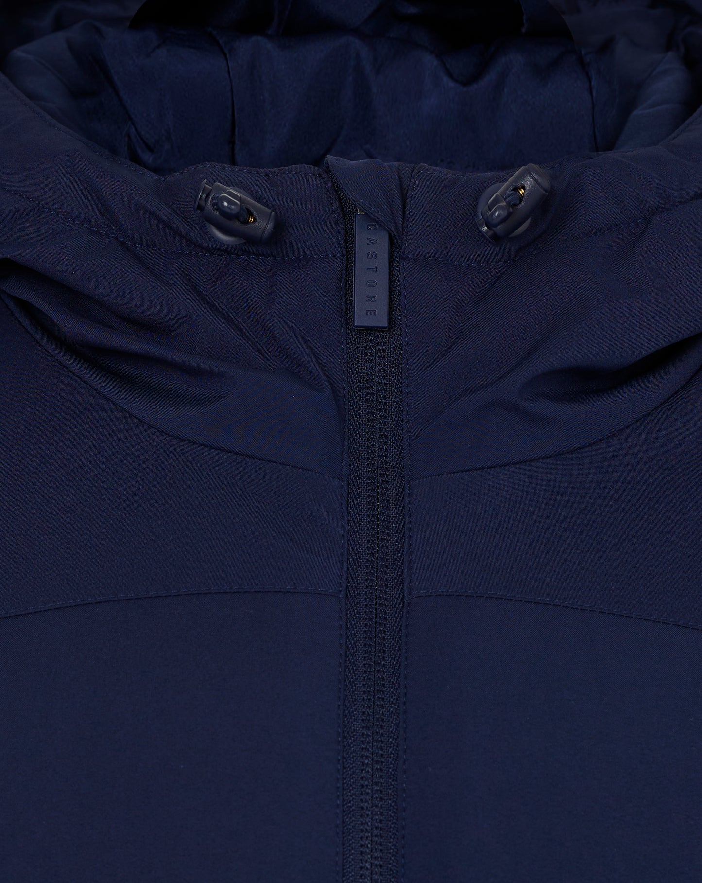 Close up of navy blue hooded jacket with hood toggle cords and center zipper