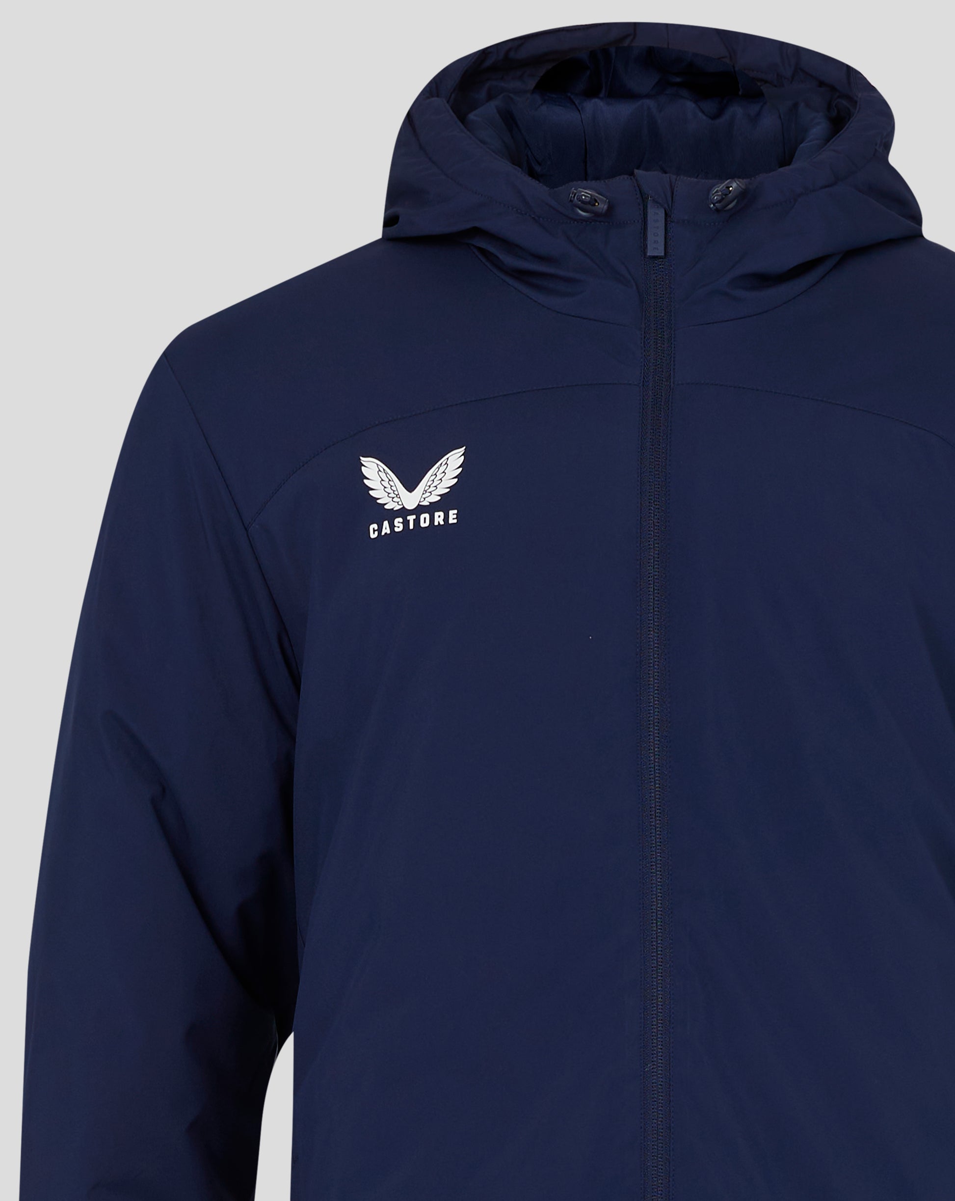 Navy blue jacket front with central zipper and seam details