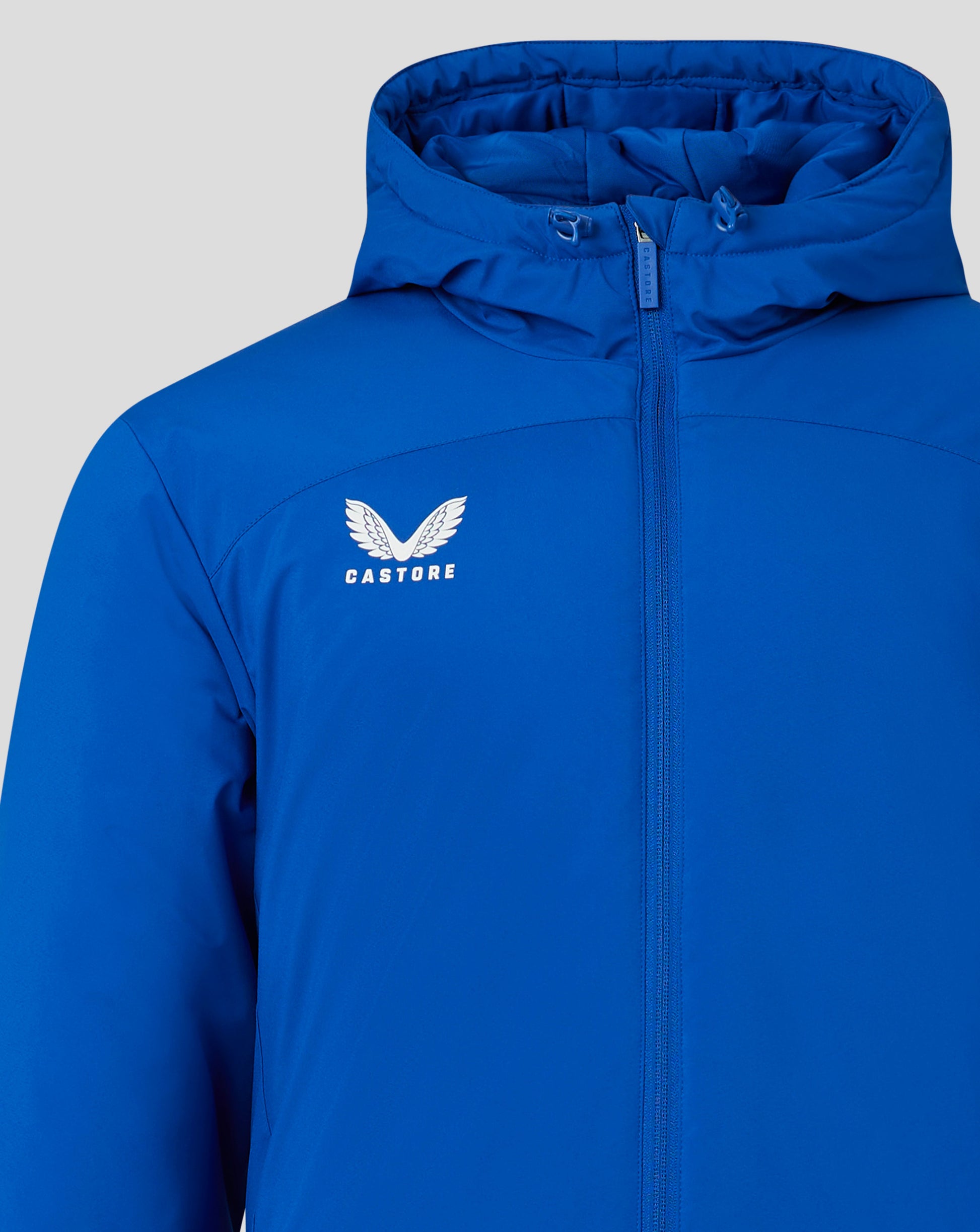 Close up of blue hooded Bench Jacket front with zipper and Castore logo visible