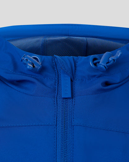Blue rain jacket close-up at the collar with a centered zipper, hood drawcords and mesh lining