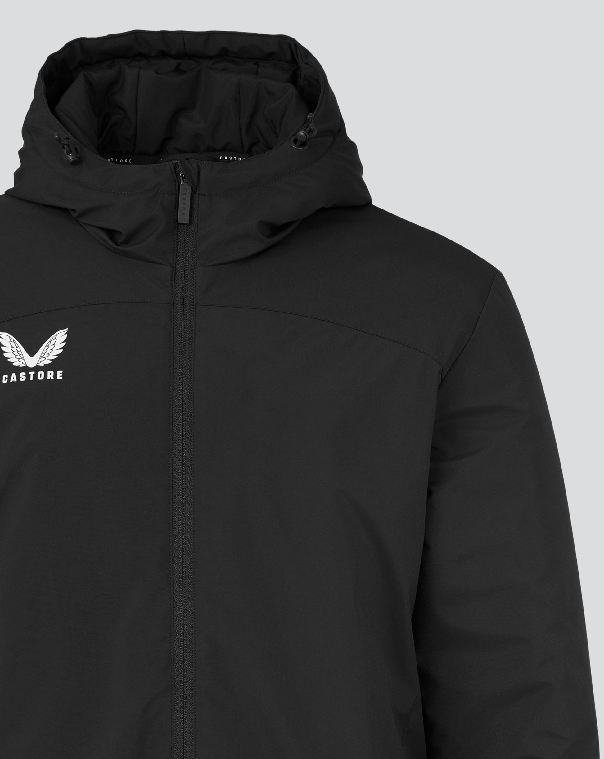 Black men's long length bench jacket with hood, front zipper and white Castore wing logo on the chest