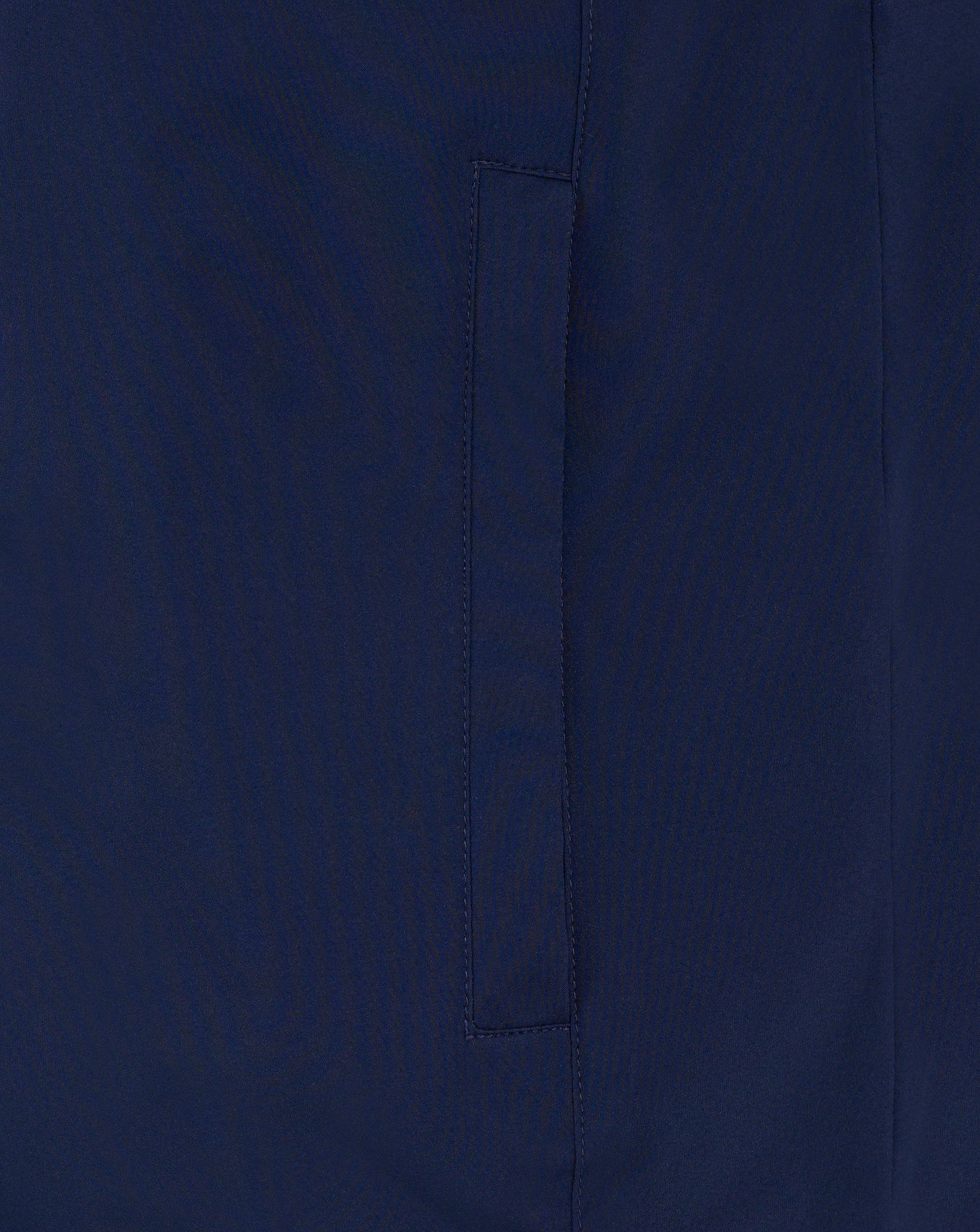 Close-up of navy fabric with vertical seam on the padded gilet