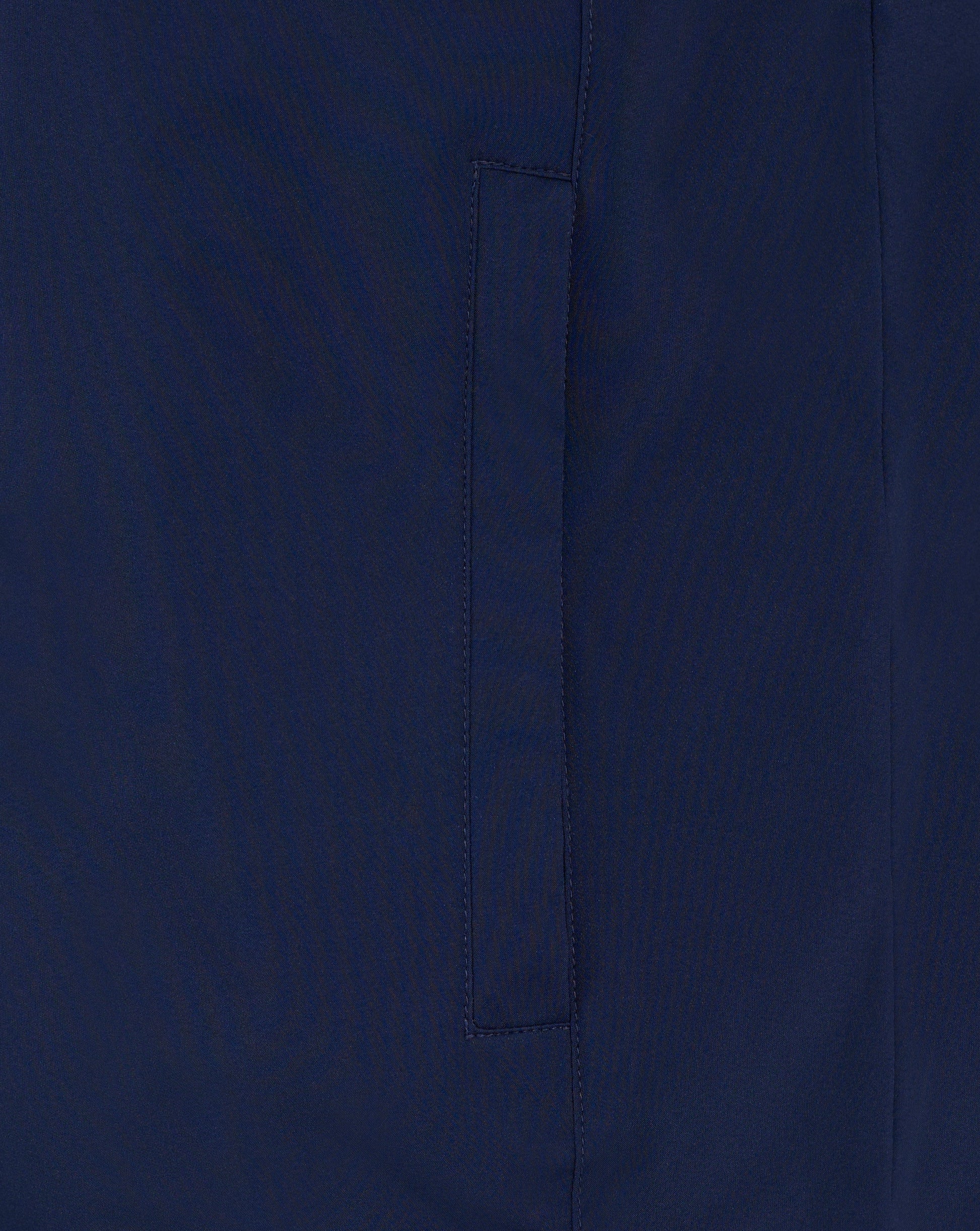 Close-up of navy fabric with vertical seam on the padded gilet