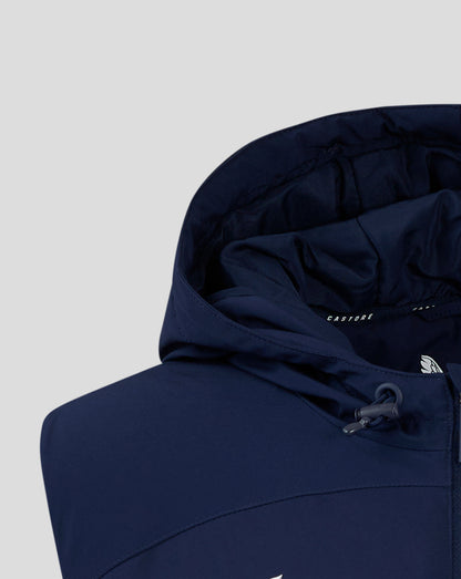 Navy padded gilet with hood; interior shows soft padding and Castore branding.