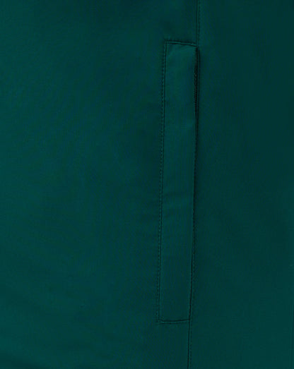 Close up of teal padded gilet fabric showing a vertical seam and pocket detail