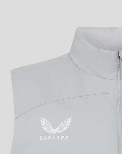 Close up of light gray padded gilet collar with zipper and Castore branding on the placket