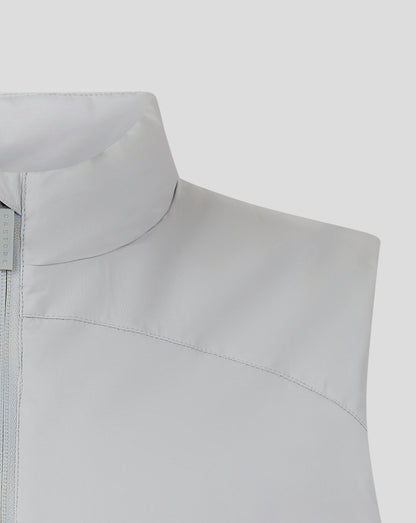 Shoulder and collar detail of light gray padded gilet with curved seams and Castore branding tag