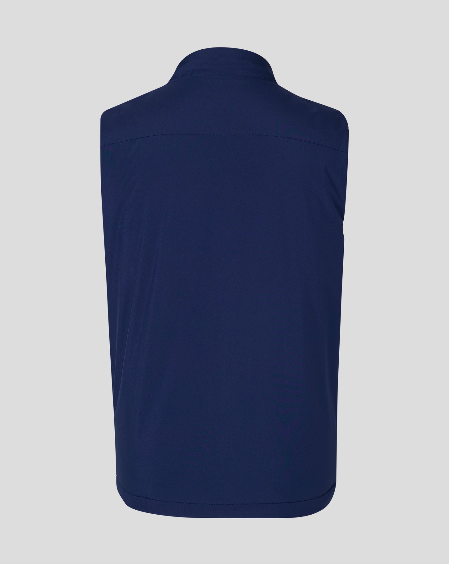 Back view of navy padded gilet with high funnel collar and curved yoke seam