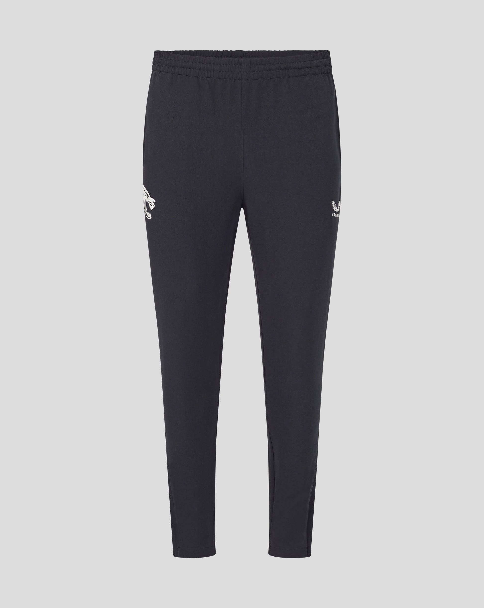 Front view of dark navy training track pants with a white tiger logo on the left thigh