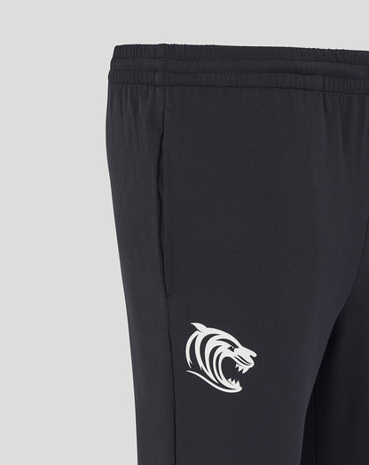 Side view of Leicester Tigers training track pants in dark navy with a white tiger logo on the leg.