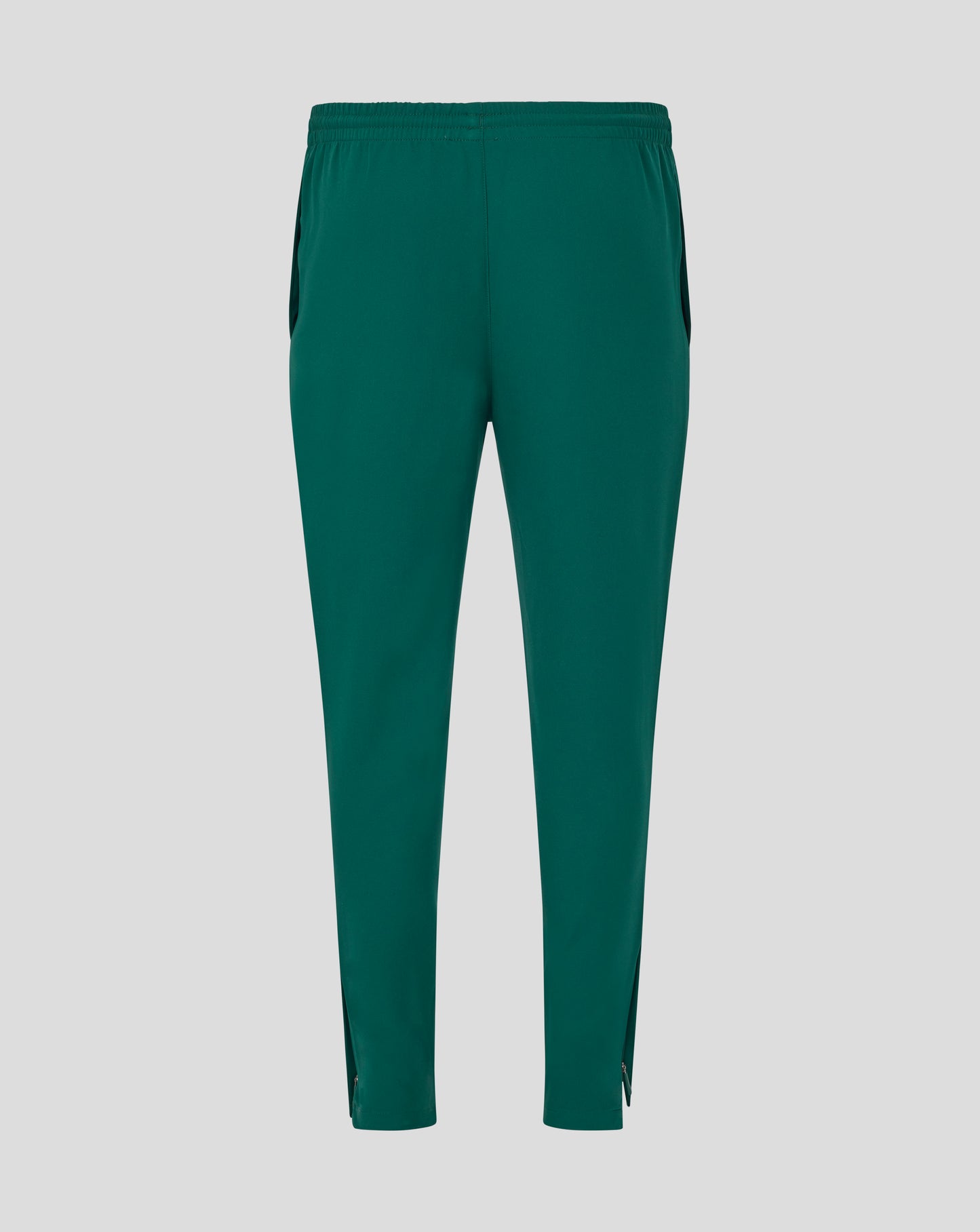 Full length view of green Botanical track pants with zip cuffs at the ankles