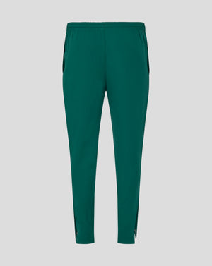 Full length view of green Botanical track pants with zip cuffs at the ankles
