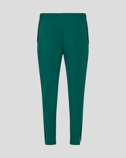 Full length view of green Botanical track pants with zip cuffs at the ankles