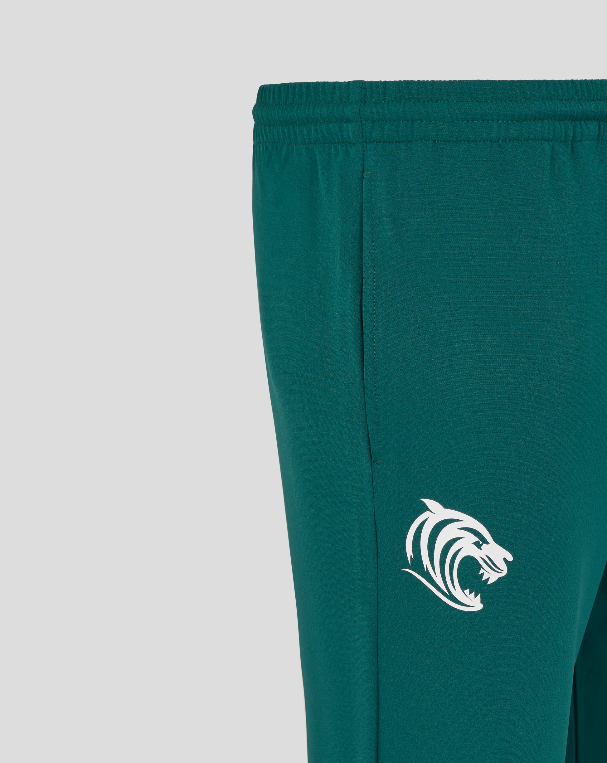 Teal Leicester Tigers training track pants close-up of elastic waistband and white tiger logo on the leg