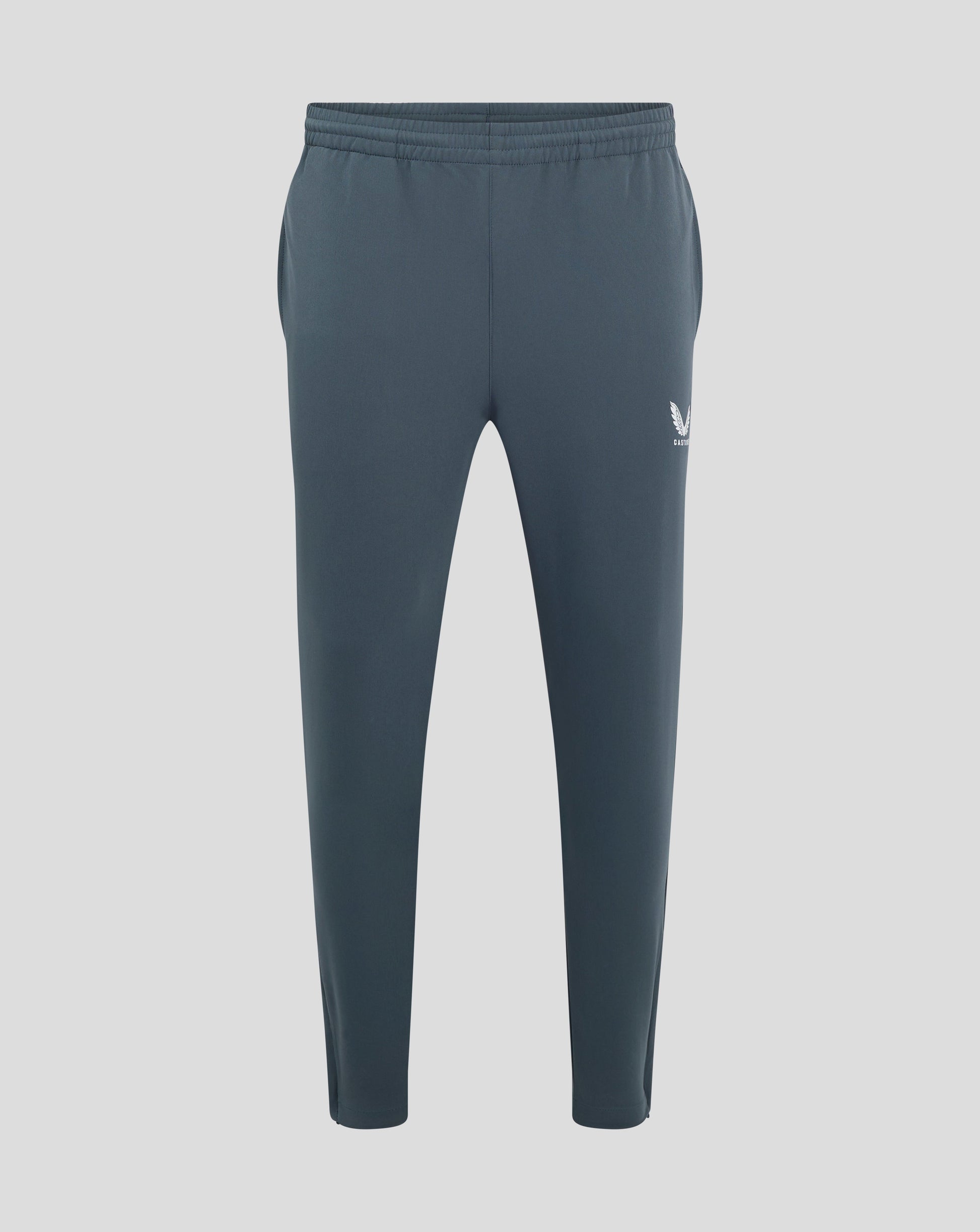 Back view of dark slate track pants with elastic waistband and Castore logo on the hip