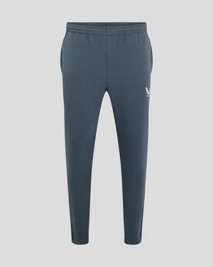 Back view of dark slate track pants with elastic waistband and Castore logo on the hip