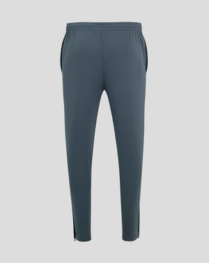Back view of dark slate track pants with central seam and tapered legs
