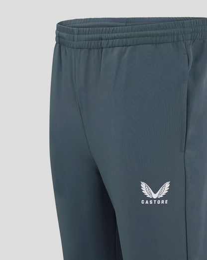 Close up of dark slate mens track pant waist showing elastic waistband with drawcord and Castore logo on the leg