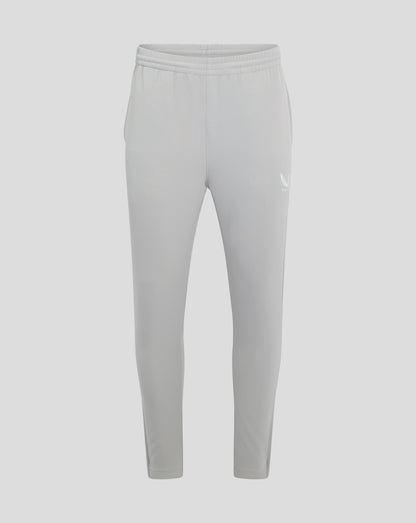 Back view of light grey track pants with elastic waistband and a small Castore wing logo at the thigh.