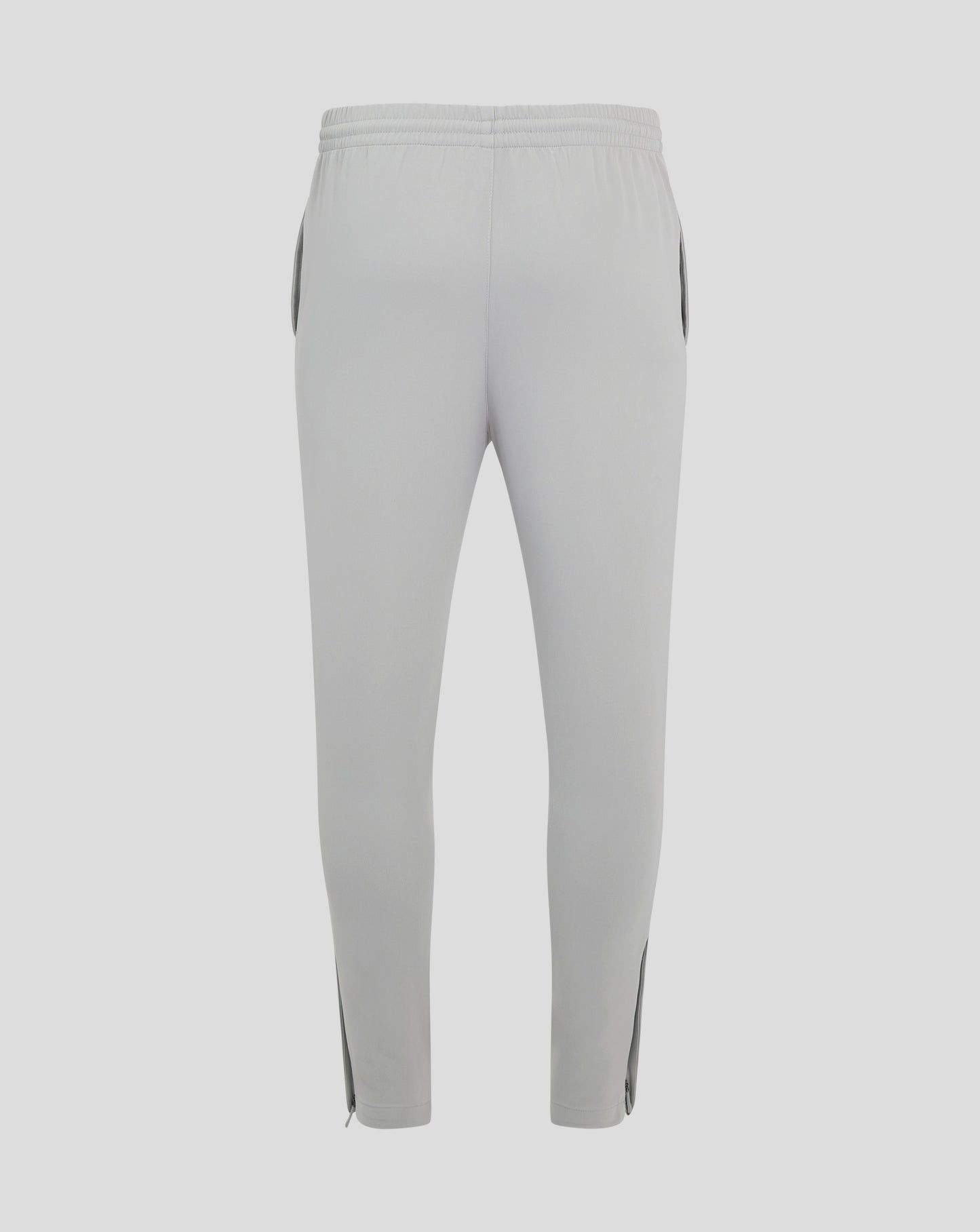 Back view of light gray mens track pants with an elastic waistband and center seam