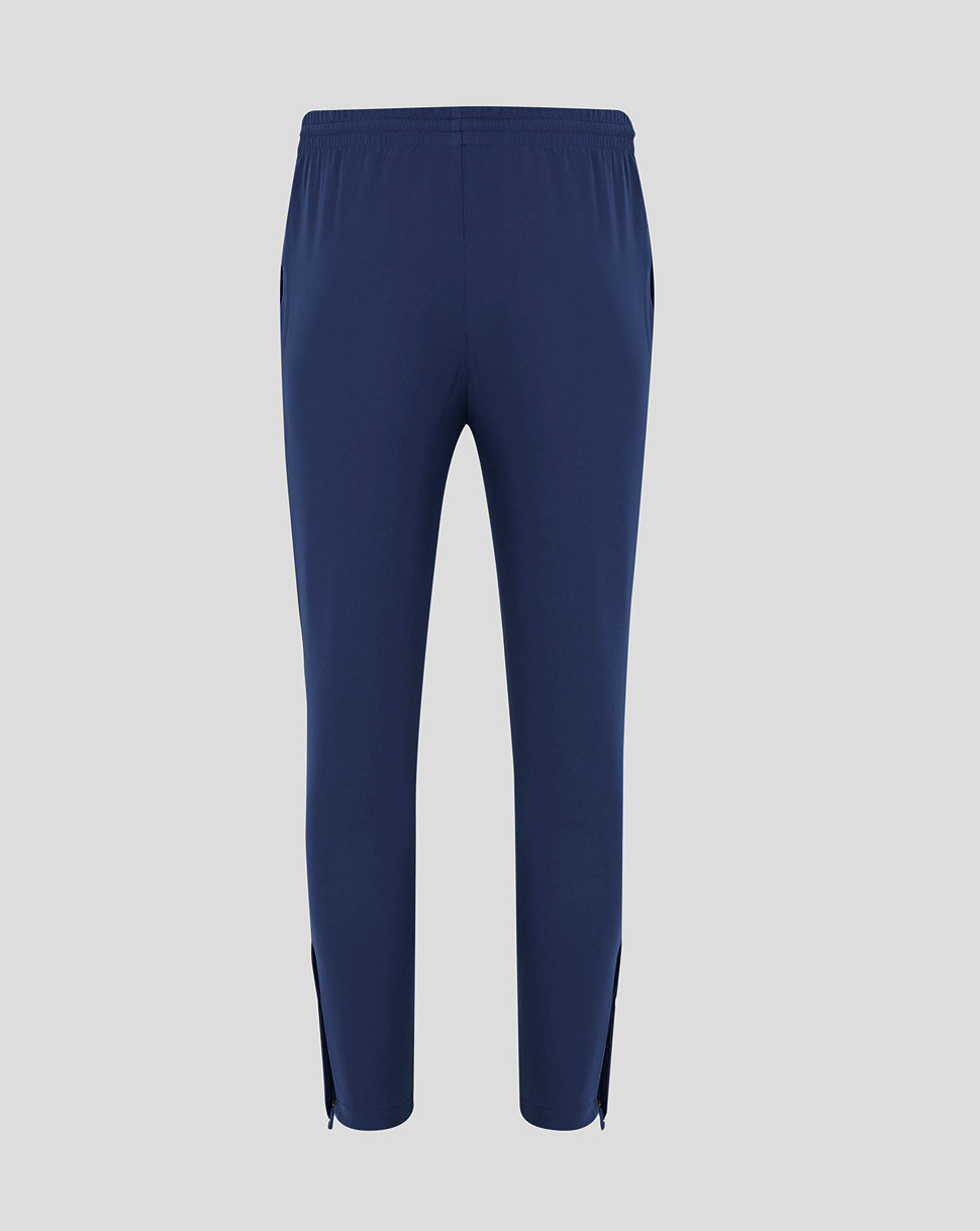 Back view of men's peacoat track pants with drawcord waistband and tapered legs.