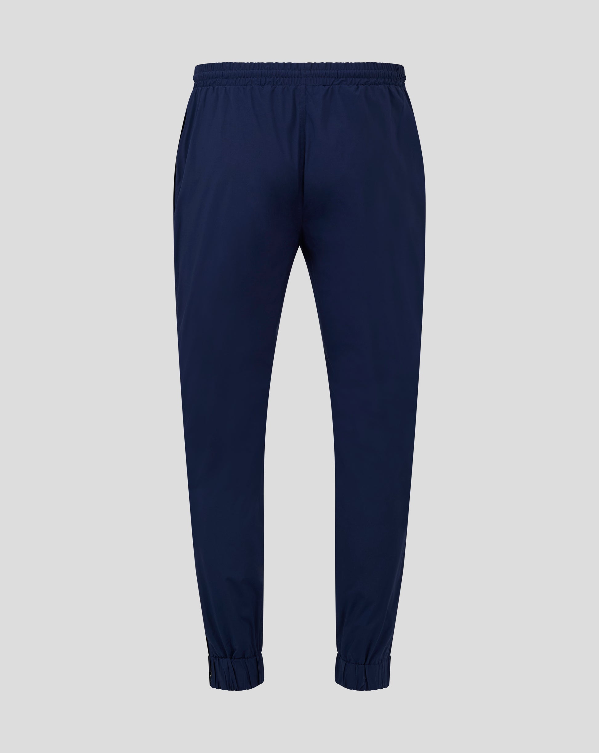 Back view of navy rugby pant with elasticated waistband and cuffs and mesh lining