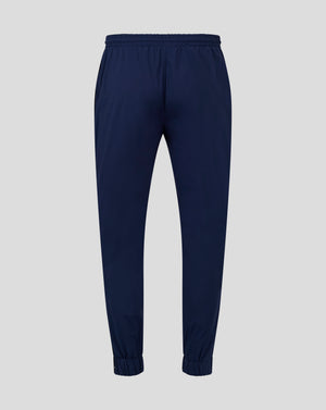 Back view of navy rugby pant with elasticated waistband and cuffs and mesh lining