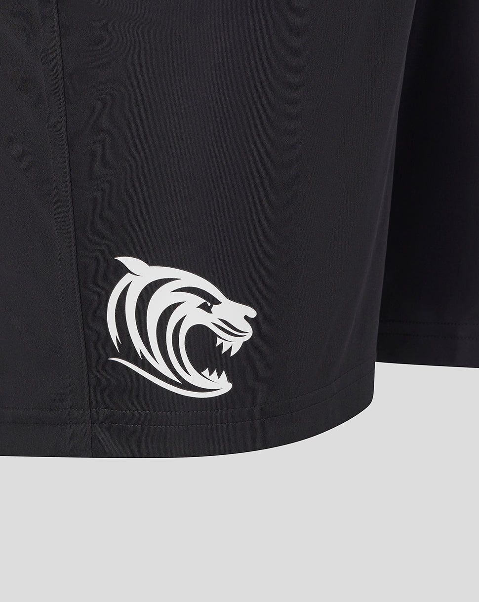 Close up of black Leicester Tigers training shorts with a white tiger logo at the hem